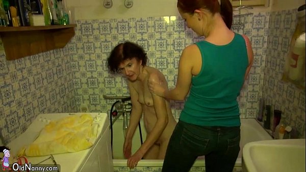 Japanese mother and daughter in bathe tub scene